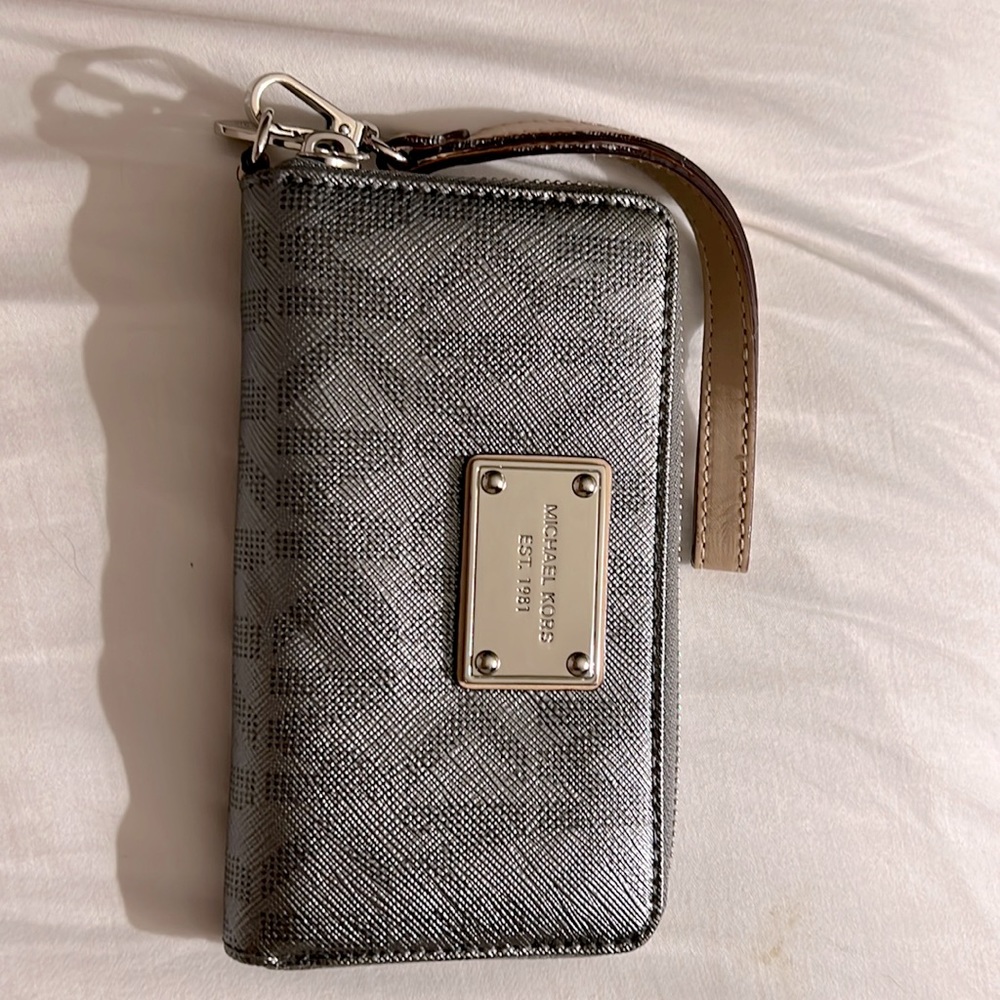 Michael Kors grey/silver wristlet like new! Plenty of room for all your things!